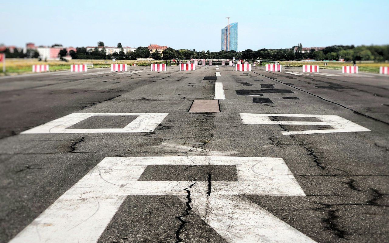 Close-up of a cracked runway threshold marking